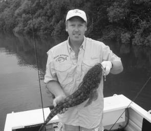 Karl Shaw with a nice flathead taken on a Taylor Made chrome-finish minnow.